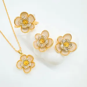 Exquisite gold-plated camellia flower jewelry set including necklace, ring and earrings.