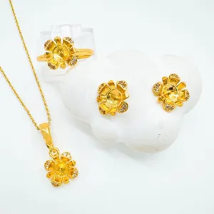 Conjunto de joyas DIY doradas con collar, anillo y pendientes de diseño floral.