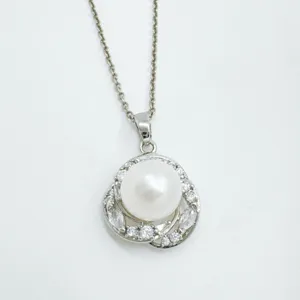 Elegant pearl pendant necklace with sparkling cubic zirconia and delicate silver chain detail.