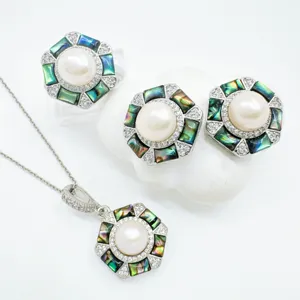 Hexagonal pearl pendant earrings ring set with natural mother-of-pearl and crystal details.
