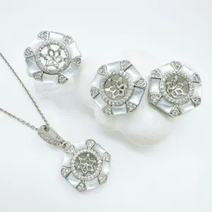 Detailed view of luxury DIY hexagonal mother-of-pearl and zirconia jewelry blank settings set.