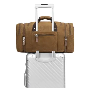 Vintage brown canvas travel duffel bag with trolley sleeve and multiple pockets for outdoor trips