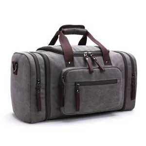 Large capacity canvas travel duffel bag, portable weekend bag with shoulder strap and pockets.