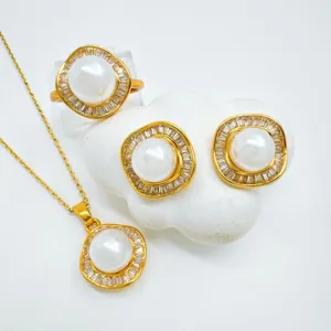 Detailed view of vintage geometric gold-plated pearl jewelry set, highlighting intricate design.