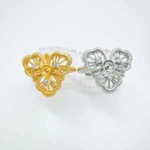 Detailed shot of copper gold-plated lace floral zircon rings, exquisite hollow design styles.