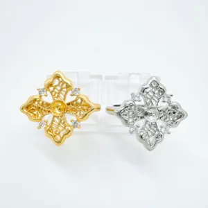 Detailed view of fashionable European style lace cross ring blanks with cubic zirconia stones.