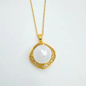 Gold geometric pearl pendant necklace close-up, elegant crystal frame detail shot for women fashion.