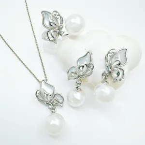 Detailed view of elegant butterfly pearl jewelry set featuring shell and sparkling zircon.