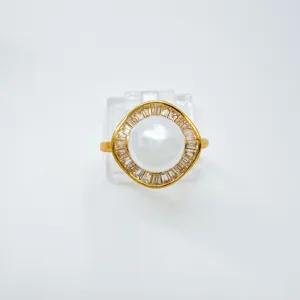 Vintage gold plated pearl ring with cubic zirconia halo geometric design detailed close up view