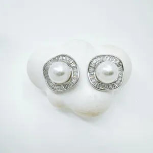 Detailed shot of retro geometric pearl stud earrings with sparkling crystal rhinestones.