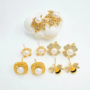 Gold plated pearl and rhinestone stud earrings set featuring leaf, flower, and bee designs.