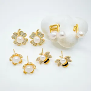 Detailed view of copper gold plated natural pearl earrings featuring cute bee and leaf designs.