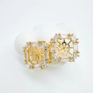 Exquisite geometric square crystal stud earrings with gold plated copper and central floral design.
