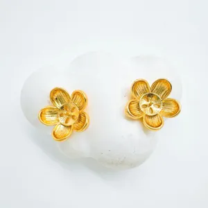 Exquisite gold-plated flower stud earrings detail, elegant floral jewelry components.