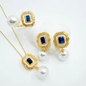 Vintage geometric pearl necklace earrings ring set with blue stone and white mother of pearl.