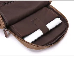 Dettaglio interno zaino per laptop in tela, borsa scolastica casual con scomparto e cinturino.
