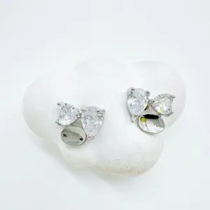 Exquisite silver crystal cluster ear studs detail shot showing fine floral zircon setting.