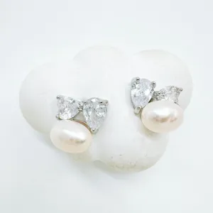Exquisite pearl and zircon stud earrings, luxury gold-plated geometric floral jewelry design.