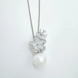 Elegant silver-tone flower pendant necklace with a white pearl drop for women fashion.
