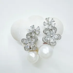 Elegant silver-tone zircon flower earrings with large pearl drops for women daily wear.