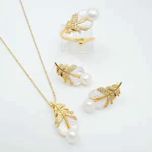 Exquisite feather pearl jewelry set detail, shimmering zirconia and natural mother of pearl.