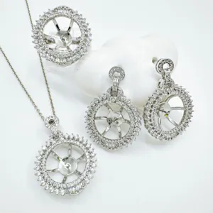 Detailed view of DIY jewelry mounting set including pendant, ring, and earrings blank settings.