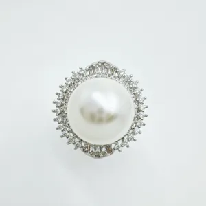 Detailed view of exquisite pearl ring mounting, sparkling zirconia halo design for elegant styles.
