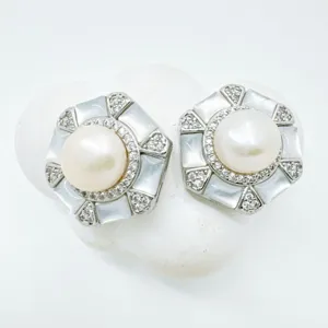 Exquisite hexagonal pearl earrings with mother of pearl and crystal details, elegant design.