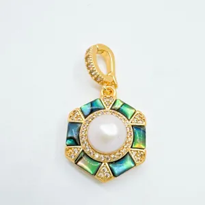 Hexagonal pendant detail featuring iridescent mother of pearl, pavé zirconia, and central pearl.