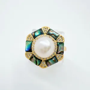Luxury hexagonal pearl ring with iridescent abalone shell and sparkling rhinestones detail view.
