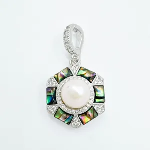 Exquisite hexagon pearl pendant detail, natural abalone shell inlay with sparkling pavé stones.