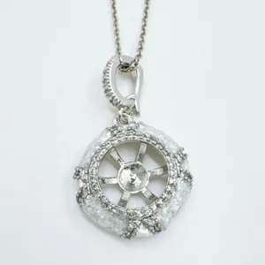 DIY jewelry pendant blank setting with shimmering pave stones and elegant wheel design.