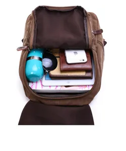 Detailed view of brown canvas backpack interior showing spacious capacity and organized storage.