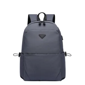 Grey polyester casual school laptop backpack with front triangle patch and straps.
