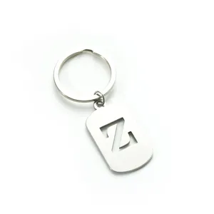 Stainless steel letter Z keychain detail shot, military dog tag style metal ring backpack accessory.