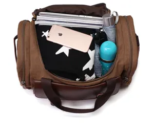 Detailed top view of the large capacity retro canvas travel duffel bag showing interior storage space.