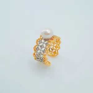Detail shot of exquisite wide lace hollow design pearl ring with gold silver finish