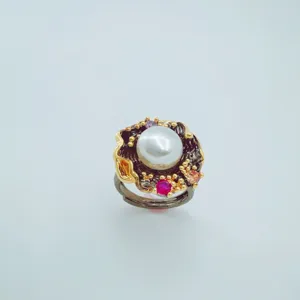 Detailed view of 18K gold plated freshwater pearl ring with sparkling cubic zirconia.