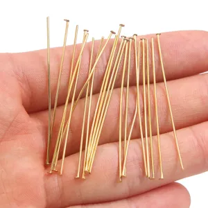 Gold metal T-pins detail view, perfect for DIY jewelry making and beading crafts.