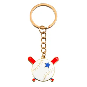 Closeup of baseball keychain featuring white enamel ball, crossed red bats and blue star.