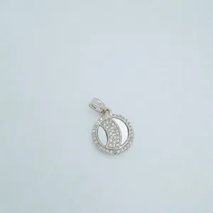 Detailed view of the round mother-of-pearl crystal paved pendant necklace accessory.