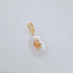 Baroque freshwater pearl pendant with gold plating and exquisite star zircon charm.
