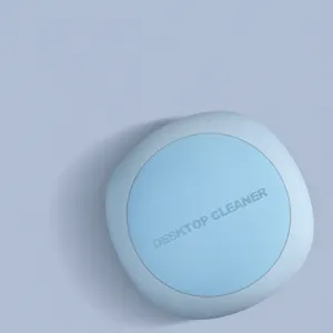 Mini aspirapolvere da tavolo senza fili azzurro, design portatile compatto per la scrivania.