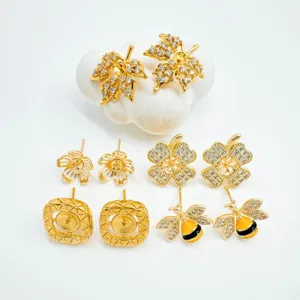Gold plated brass leaf bee flower earring findings detailed display shot for jewelry making.