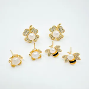 Detailed view of gold-plated pearl and crystal bee and leaf stud earrings set for women fashion.