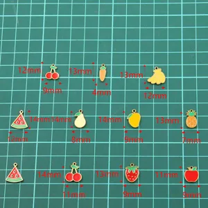 Detail shot of assorted fruit enamel charms, stainless steel gold plated pendant accessories.