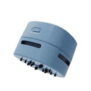 Portable mini desktop vacuum cleaner with soft cleaning bristles for home office desk crumbs cleanup.