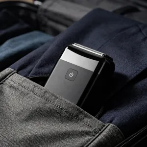 Compact men's portable electric shaver for travel, efficient waterproof foil razor for daily use.
