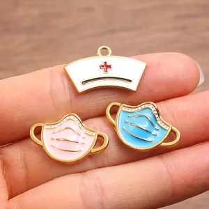 Close-up detail of stainless steel medical charms, featuring nurse hat and cute face masks.