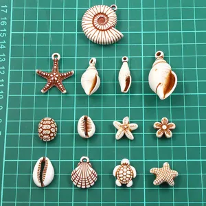 Close-up view of diverse acrylic ocean shell and starfish charms for DIY crafts and jewelry making.